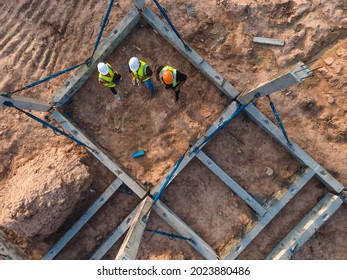 Aerial View Team Civil Engineer Consultant Discussion Meeting And Inspection Structure Prefabricated Concrete In Construction Site Work.