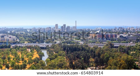 Aerial view of Tel-Aviv skyline with Yarkon River, road and sea