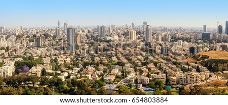 Aerial view of Tel-Aviv urban skyline with skyscrapers on a sunny day