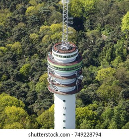 Aerial View Of A Television Transmission Tower Between Tilburg En Loon Op Zand, Holland Surrounded By Green Woods. 