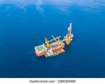 Aerial View Of Tender Drilling Oil Rig (Barge Oil Rig) In The Middle Of The Ocean
