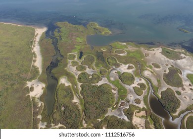 Aerial View Of  The Texas Gulf Coast, Galveston Island, United States Of America. Travel Landscape Panorama Of West Galveston Bay, A Large Nature Preserve Area.
