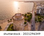 Aerial view of Thessaloniki seafront during the sunset and the White Tower at the foreground, Greece.