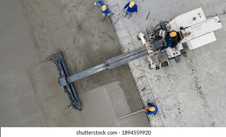 Aerial view or top view construction worker pouring concrete