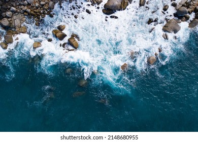 Aerial view Top down seashore big wave crashing on rock cliff Beautiful blue sea surface in sunny day summer background Amazing seascape top view seacoast at Phuket Thailand - Powered by Shutterstock