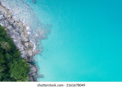 Aerial view Top down seashore wave crashing on seashore Beautiful turquoise sea surface in sunny day Good weather day summer background