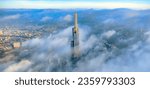 Aerial view of the top of the tallest skyscraper in Ho Chi Minh City on a foggy winter day. Cityscape in Ho Chi Minh City, Vietnam