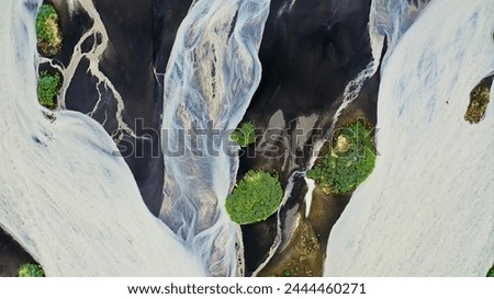 Aerial view of the torrents of water from the melting of the Fjallsjokull glacier, on its way to the sea, in southeast Iceland.