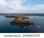 Aerial view of the town center and beaches of Newquay, a popular tourist destination in cornwall, england