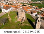 Aerial view of town of Mogadouro town with ruined medieval Castle of Mogadouro on hilltop, northern Portugal