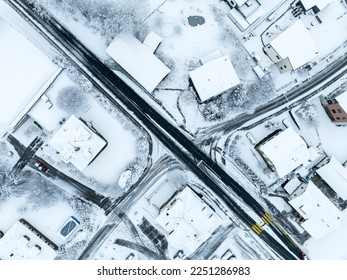Aerial view of town with snow covered houses. Roof tops with snow on residential buildings in Switzerland. - Powered by Shutterstock