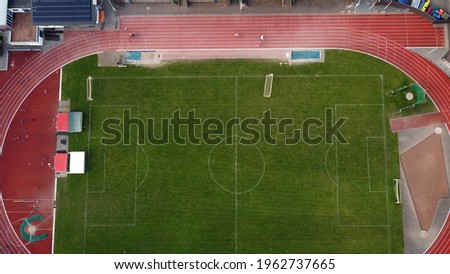 Aerial view of track and field stadium were several sports are done like athletic contests established on the skills of running jumping, and throwing name is derived from where the sport takes place