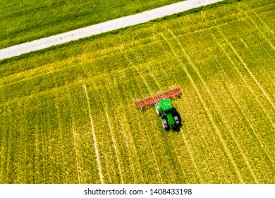 Aerial view, tractor drives over a field and loosens the ground, Usingen, Schwalbach, Hochtaunuskreis, Hesse, Germany, May 2019 - Shutterstock ID 1408433198