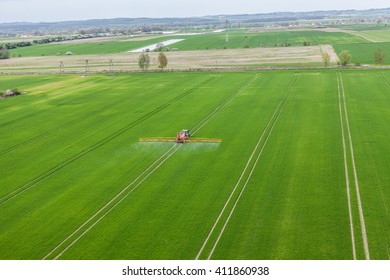 Aerial View Of The Tractor Working On The Harvest Field  In Poland