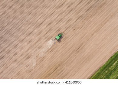 Aerial View Of The Tractor Working On The Harvest Field  In Poland