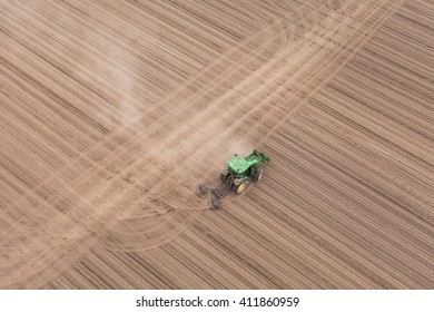 Aerial View Of The Tractor Working On The Harvest Field  In Poland