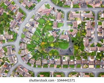 Aerial view of traditional housing estate in England. Looking straight down with a satellite image style, the houses look like a miniature village