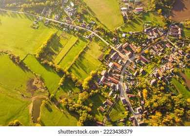 Aerial view of traditional village in afternoon sunny rays. Czech autumn countryside from top down view. Lisice, Czech republic, European union.