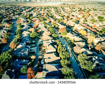 Aerial View Traditional Village-style Subdivision Residential Area Fall Season Near Dallas, Texas, US. Row Of Single-family Houses, Backyard Garden, Swimming Pool, Lake And Business Zone In Distance