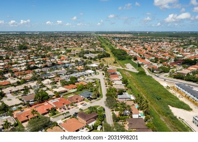 Aerial View Of A Train Track In A Miami Neighborhood.