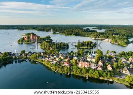 Aerial view of Trakai Island Castle and its surroundings, located in Trakai town, Lithuania. Beautiful view from the above on summer sunset.