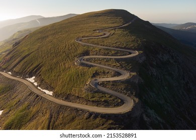 Aerial view of Transalpina mountain road, at sunrise	
