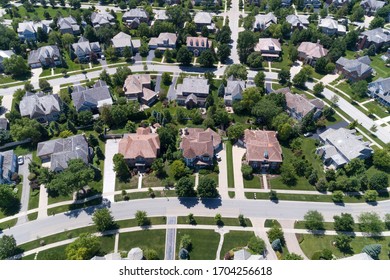 Aerial view of a tree-lined neighborhood in a Chicago suburban city in summer.