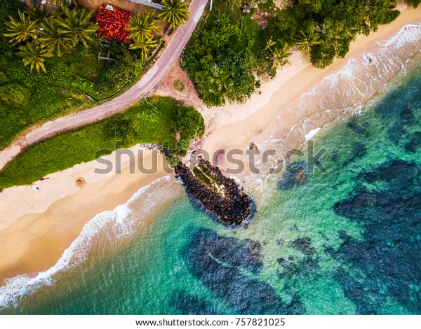 Aerial View Of The Tropical Beach With Palm Trees On The Shore And