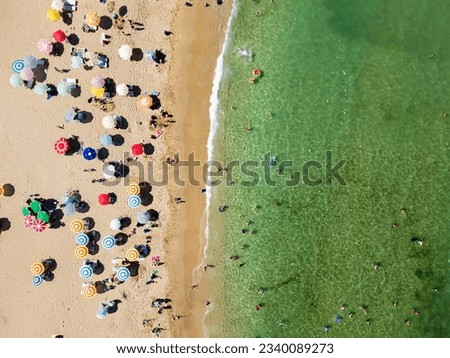 Similar – Aerial View From Flying Drone Of People Crowd Relaxing On Algarve Beach In Portugal