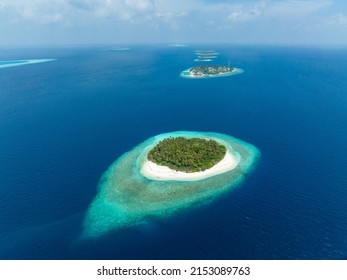 Aerial view of a tropical island in Baa atoll, Maldives