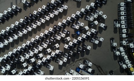 AERIAL VIEW: Trucks On Parking  -selling Company - Close To The Highway. Top View Car Parking Lot. Truck Driver Company. View From The Bird's Flight. Aerial Photography.  