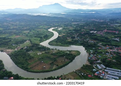 a aerial view of tuaran river with kinabalu at background  - Shutterstock ID 2203170419