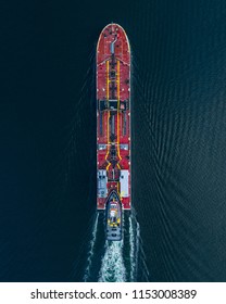 Aerial View Of A Tug Boat Pushing A Barge Carrying Crude Oil