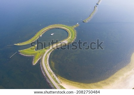 Aerial view of Tulpeiland in Wolderwijd off the coast of Zeewolde, artificial peninsula in the shape of a tulip. The elongated natural islands form the trunk. Zeewolde, Flevoland, the Netherlands