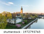 Aerial view of Turku cathedral with blossoming cherry trees.