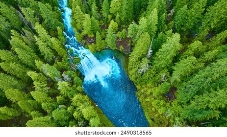 Aerial View of Turquoise River and Waterfalls Through Lush Forest - Powered by Shutterstock