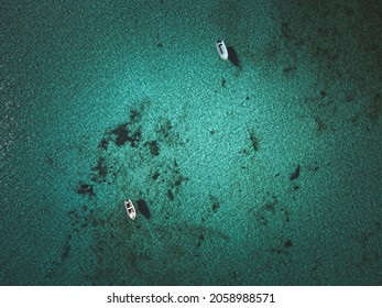 An Aerial View Of Two Boats On The Sea