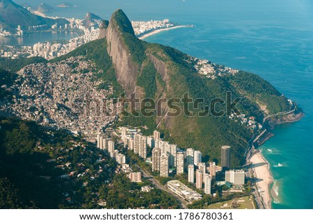 Aerial View of Two Brothers Mountain With Biggest in Brazil Favela Rocinha and Apartment Buildings at Bottom in Front of the Beach in Rio de Janeiro