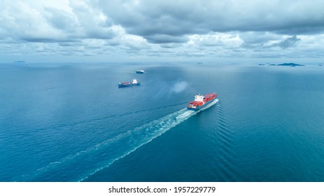 aerial view two container ship runing have wave in green sea, Chon Buri, thailand.