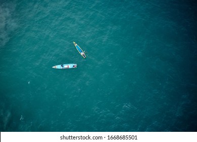 Aerial View Of Two Fishers Boats In The Turquoise Waters In Kerala, India