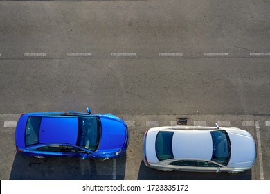 Aerial view of two parked passenger cars. 