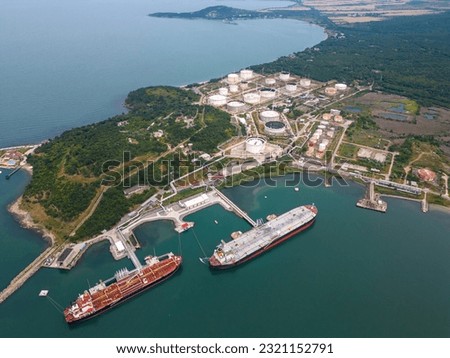 An aerial view of two tankers near an oil storage facility on the shores of the Black Sea in Bulgaria, showcasing the maritime industry and coastal infrastructure