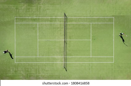 aerial view of two tennis players on an artificial grass court during a championship