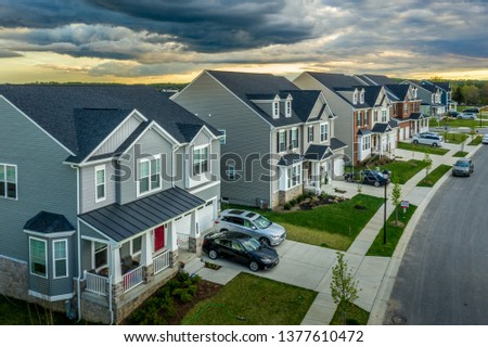 Aerial view of typical American new construction neighborhood street in Maryland for the upper middle class, single family homes USA real estate