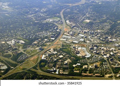 Aerial view of Tysons Corner, McLean, the commercial center of Northern Virginia in Fairfax County, near Washington DC, from the north. The Beltway (I-495) running from lower left corner up.