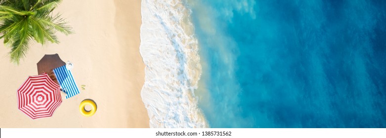 Aerial view of umbrella,towel on sand beach.Copy space for your text.