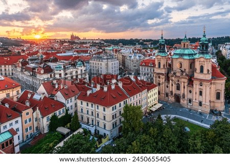 The aerial view of UNESCO site Prague cityscape of downtown and the castle and the St. Vitus Cathedral in sunset. 