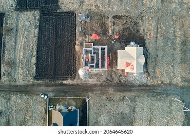 Aerial View Of Unfinished Frame Of Private House Foundation Under Construction.