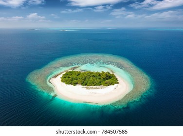 Aerial view of an uninhabited, tropical island in the Maldives - Shutterstock ID 784507585