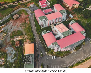 Aerial View Of University Of Nigeria Nsukka Showing A Football Field, Close View Of Hostels And Office Buildings.